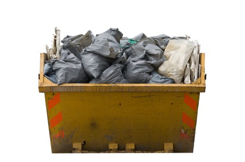 Bags of segregated recyclables ready for transfer at a recycling centre